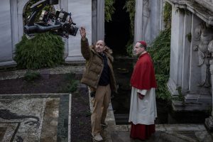 (L to R) Director Edward Berger and actor Ralph Fiennes on the set of CONCLAVE, a Focus Features release. Credit: Philippe Antonello/Focus Features ©2024 All Rights Reserved.